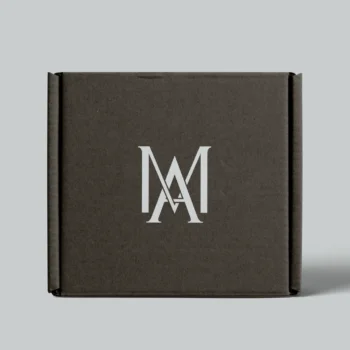 Elegant AM monogram printed on a luxury black box with gold foil details