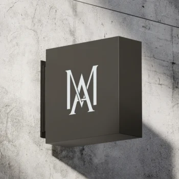 Modern AM monogram displayed on a sleek metal sign for branding purposes